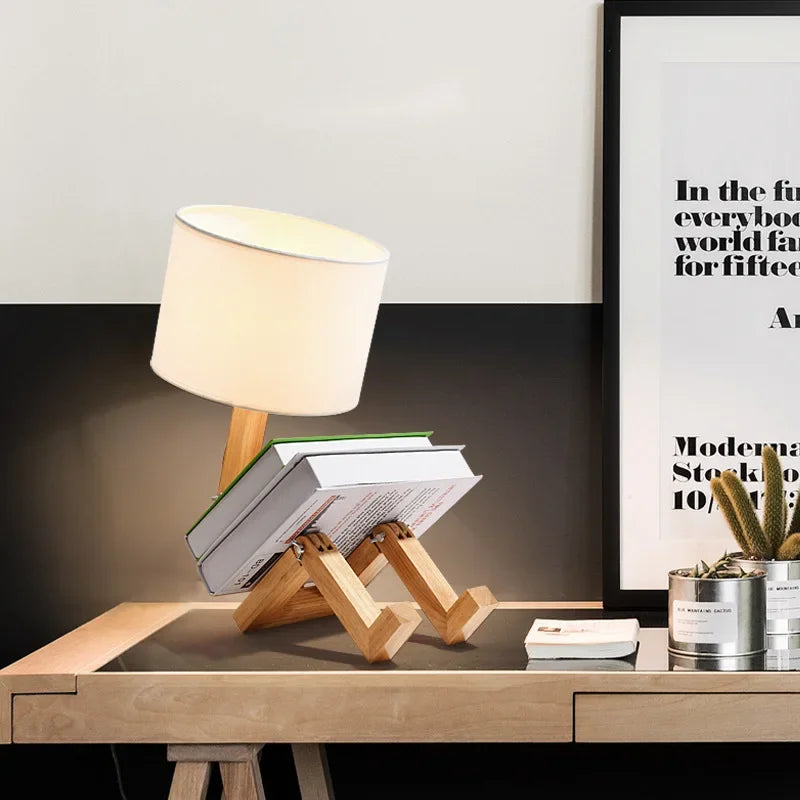 Illuminate your space with our Adjusted Robot Shape Table Lamp! This unique E27 lamp features a wooden and fabric design, perfect for bedrooms or study rooms. Its foldable structure offers versatility for any setting. Enhance your decor today!
