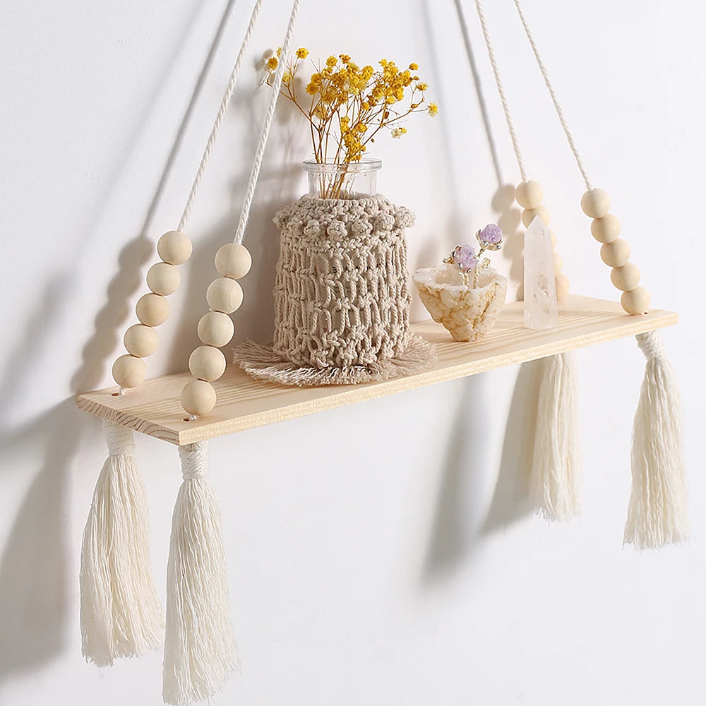 Enhance your home with our 2Pcs Wooden Wall Shelf Set! Featuring a charming macrame design and wood beads, these floating shelves add a stunning Nordic touch. Perfect for displaying plants, photos, and decor in a stylish boho aesthetic!