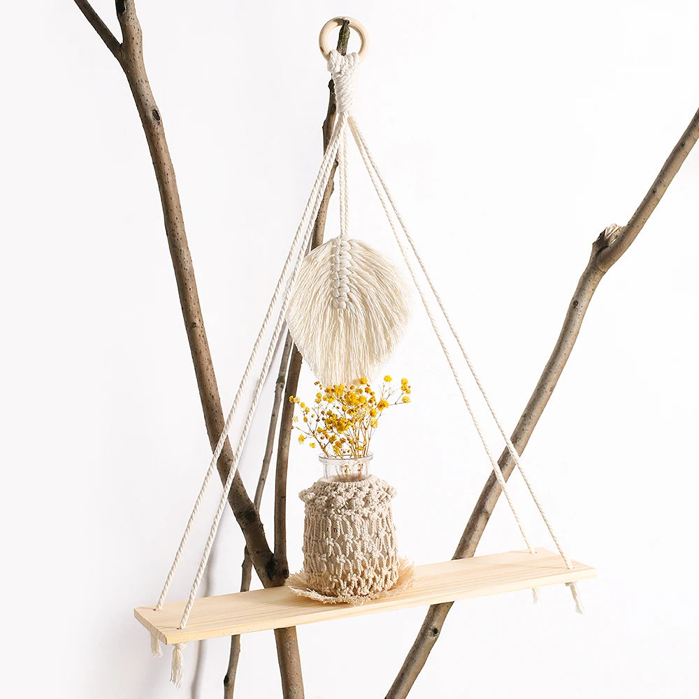 Enhance your home with our 2Pcs Wooden Wall Shelf Set! Featuring a charming macrame design and wood beads, these floating shelves add a stunning Nordic touch. Perfect for displaying plants, photos, and decor in a stylish boho aesthetic!