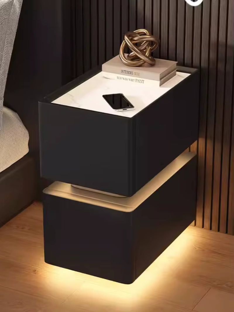 Elevate your bedroom with our Creative Intelligent Bedside Table! Featuring wireless charging, modern storage, and a sensor light, this stylish nightstand is a perfect blend of innovation and elegance.