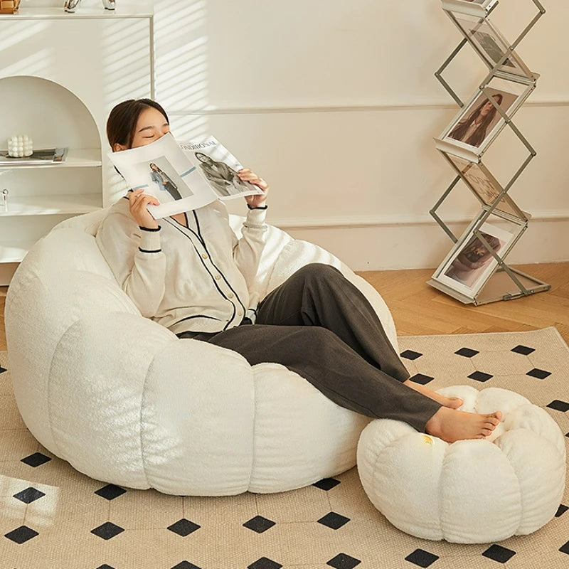 Relax in style with our modern lazy sofa chair! Perfect for balcony or living room, this small sofa with stool offers comfort and elegance for your bedroom or leisure space.