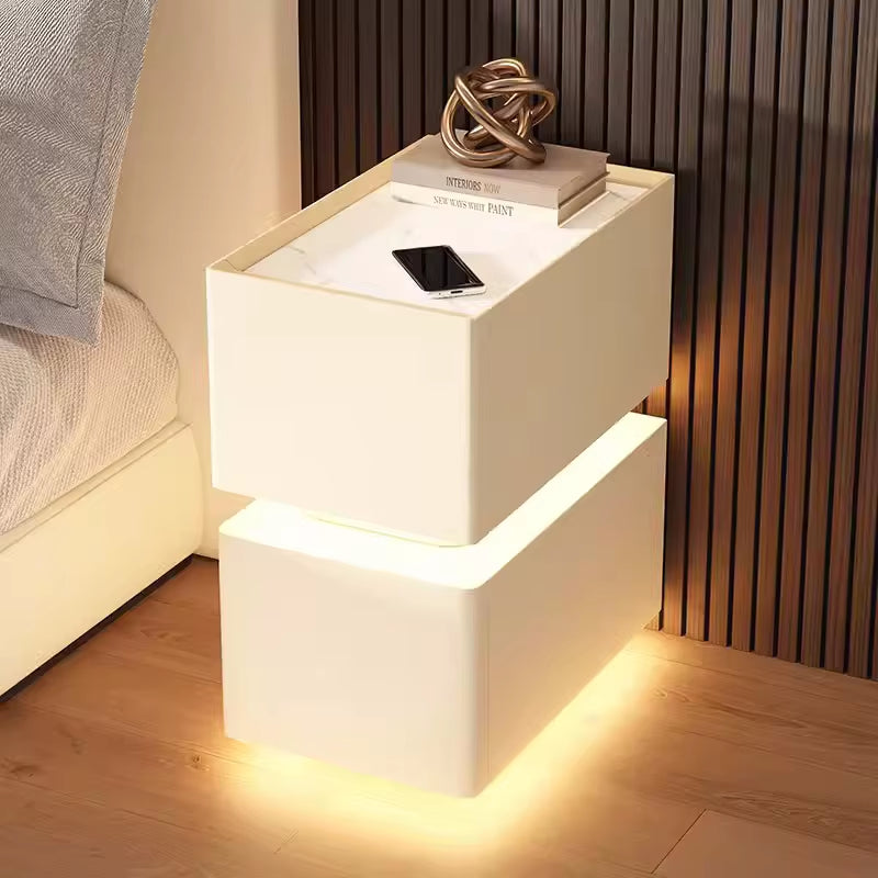Elevate your bedroom with our Creative Intelligent Bedside Table! Featuring wireless charging, modern storage, and a sensor light, this stylish nightstand is a perfect blend of innovation and elegance.