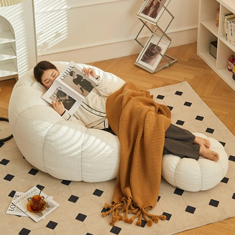 Relax in style with our modern lazy sofa chair! Perfect for balcony or living room, this small sofa with stool offers comfort and elegance for your bedroom or leisure space.