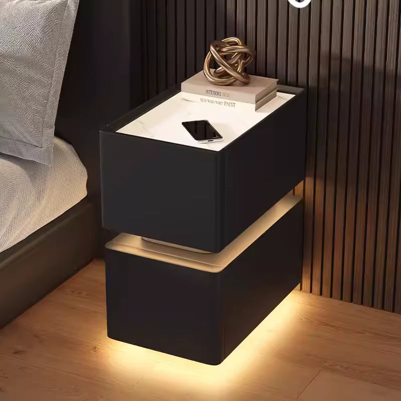 Elevate your bedroom with our Creative Intelligent Bedside Table! Featuring wireless charging, modern storage, and a sensor light, this stylish nightstand is a perfect blend of innovation and elegance.