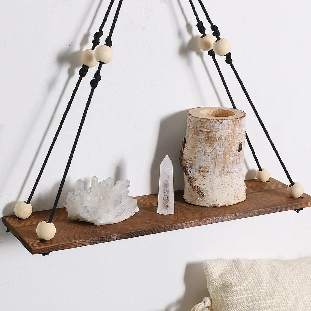 Enhance your home with our 2Pcs Wooden Wall Shelf Set! Featuring a charming macrame design and wood beads, these floating shelves add a stunning Nordic touch. Perfect for displaying plants, photos, and decor in a stylish boho aesthetic!