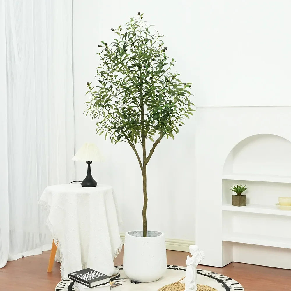 Trendy large artificial olive tree, perfect for home and garden decor. This faux green potted plant complements Nordic-style interiors, adding a touch of elegance and freshness to any space!