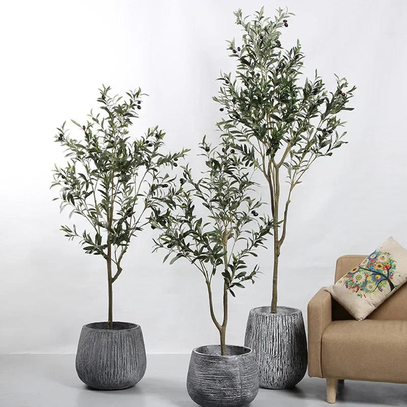 Trendy large artificial olive tree, perfect for home and garden decor. This faux green potted plant complements Nordic-style interiors, adding a touch of elegance and freshness to any space!