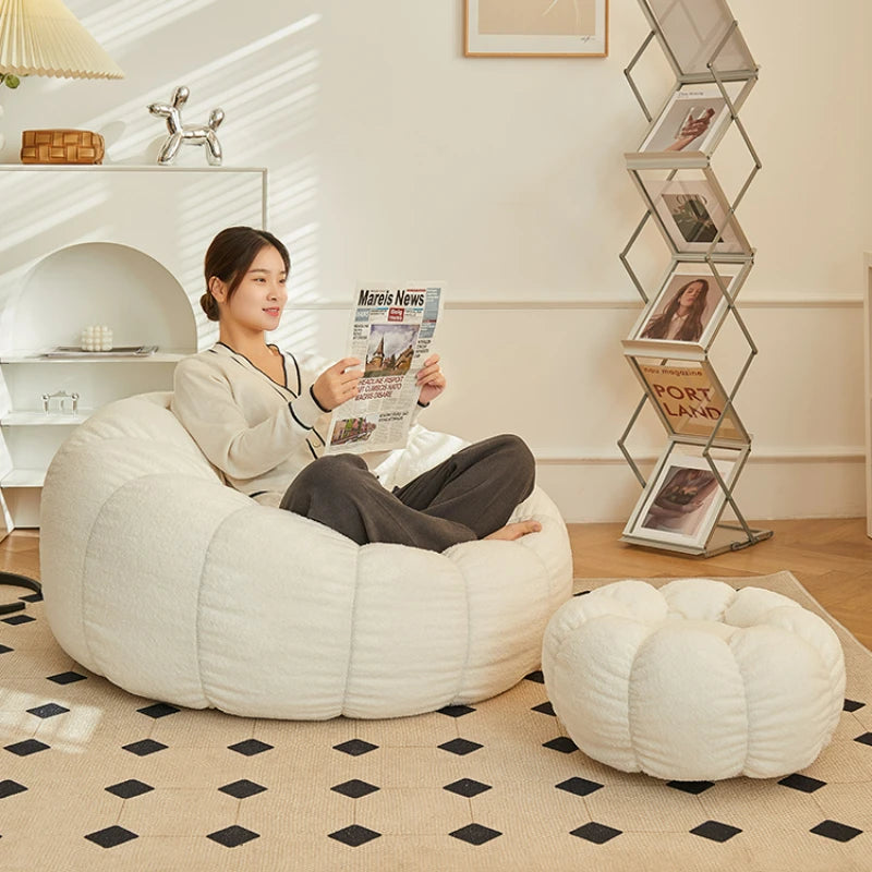 Relax in style with our modern lazy sofa chair! Perfect for balcony or living room, this small sofa with stool offers comfort and elegance for your bedroom or leisure space.